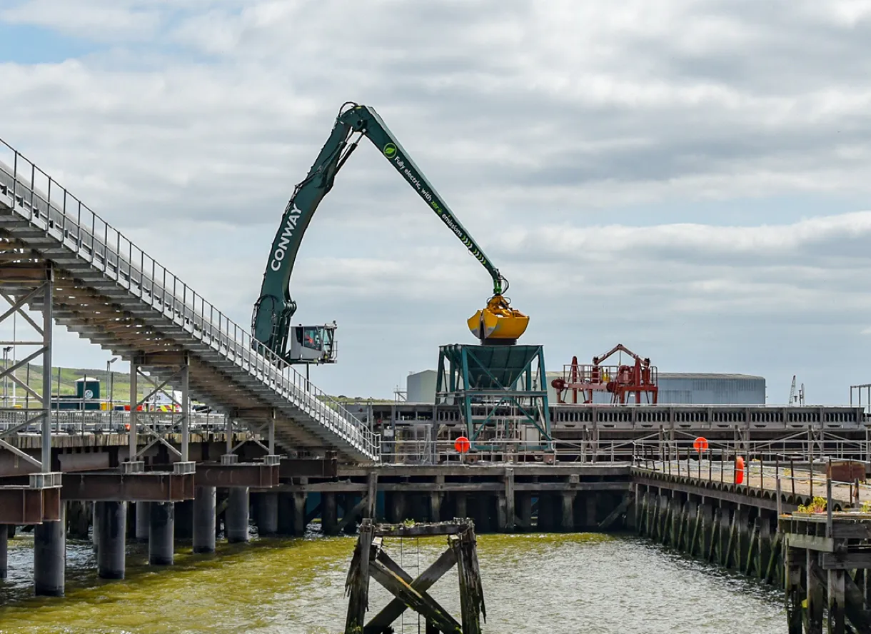 Conway crane at work by a river